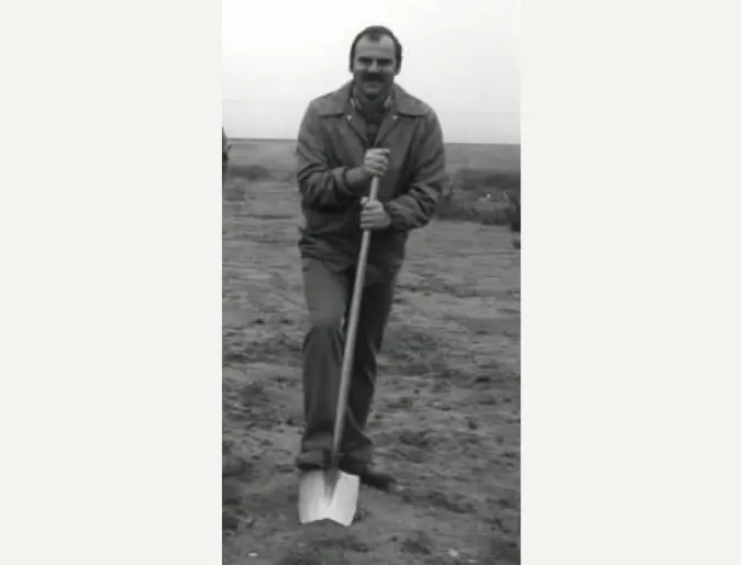Dr. Duane Schnittker breaking ground with a shovel