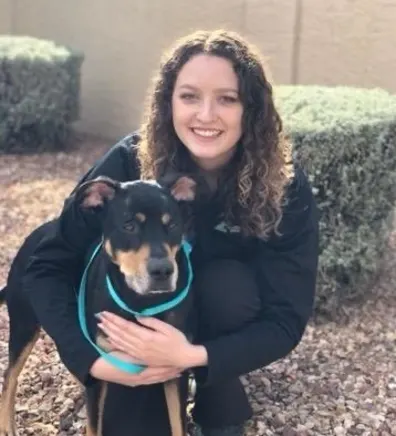 Allison and black dog- Lead CSR at Arizona Avenue Animal Clinic