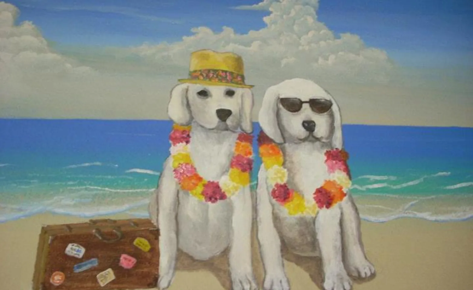 A painted mural of two white dogs at the beach wearing leis, sunglasses, and a sun hat.