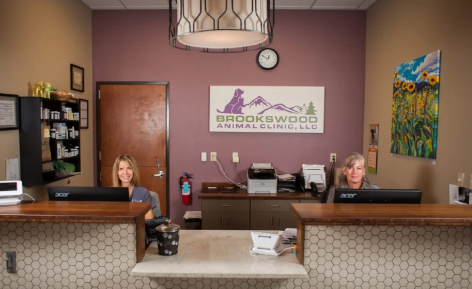 Two receptionists at the front desk of Brookwood Animal Clinic Two receptionists at the front desk of Brookwood Animal Clinic