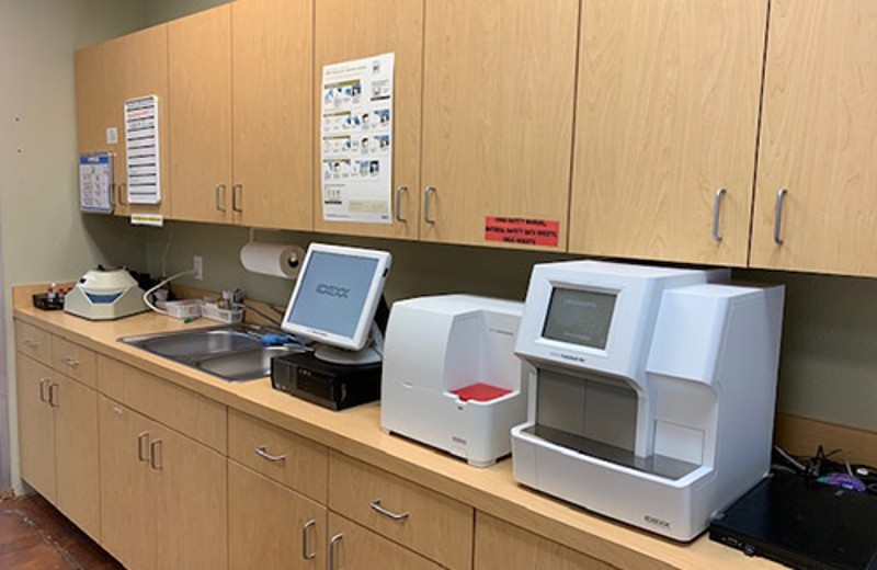 View of Cabinets With Equipment on Top