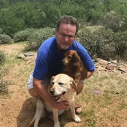 Dr. Tim Halstead with two dogs