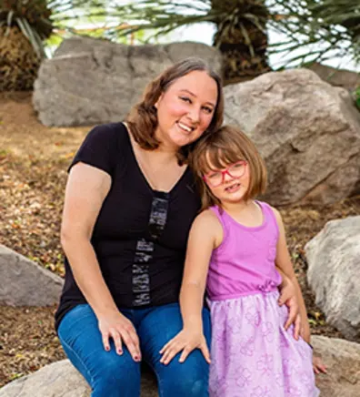 Kelly Guerrero with daughter in purple dress Kelly Guerrero with daughter in purple dress