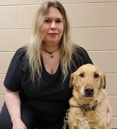 Mary M. and dog at May Veterinary Clinic, Northridge.