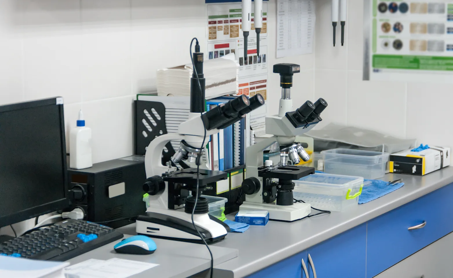 Microscopes sitting on a work bench in a veterinarian's office