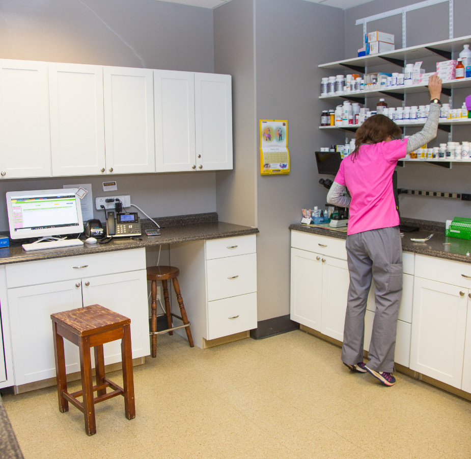 Medication room with staff member working