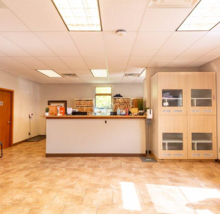 A photo of the welcoming lobby desk at Dunes Animal Hospital.