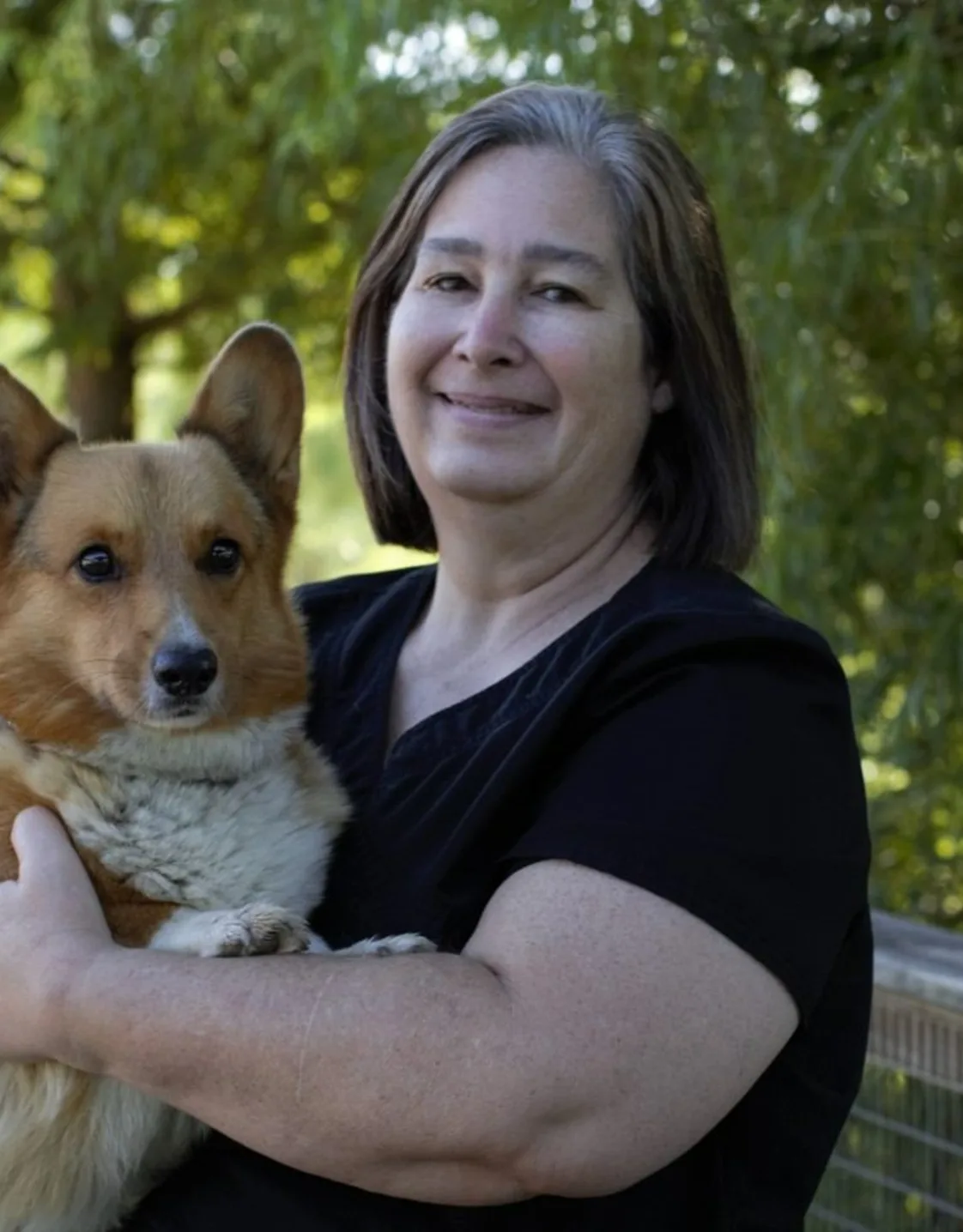 Dana with a Corgi at Stuebner Airline Veterinary Hospital Dana with a Corgi at Stuebner Airline Veterinary Hospital