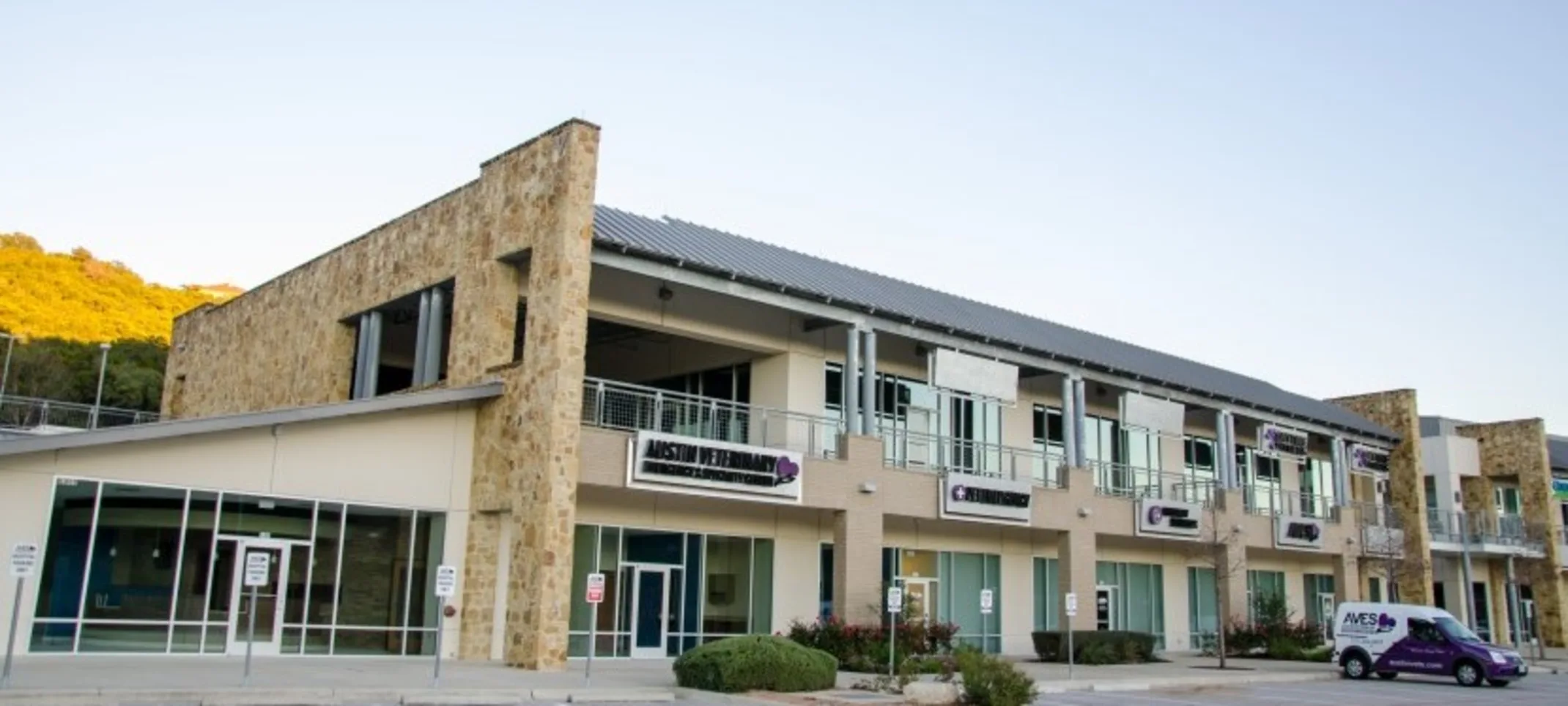 Front of the exterior building of AVES during the day Front of the exterior building of AVES during the day