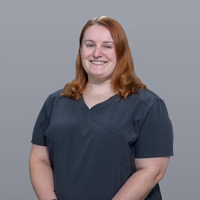 Dr. Courtney Schiller with a dog Dr. Courtney Schiller with a dog