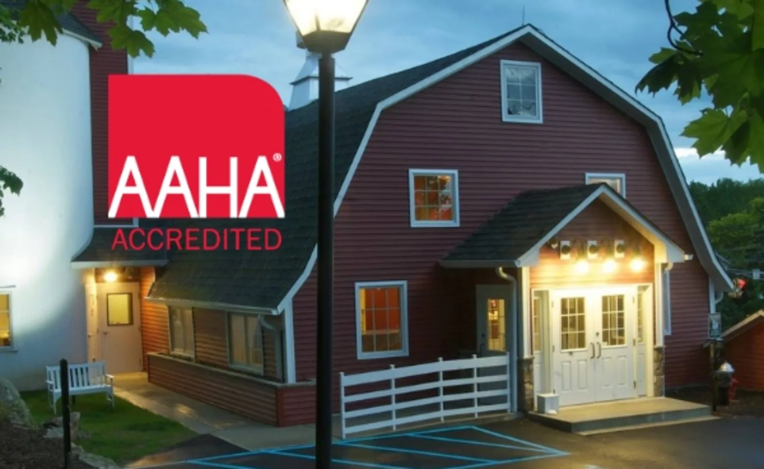 Andover Animal Hospital on a cloudy day with the AAHA red logo on the left side of the image Andover Animal Hospital on a cloudy day with the AAHA red logo on the left side of the image