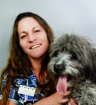 Marie with small dog at Rainbow Animal Hospital