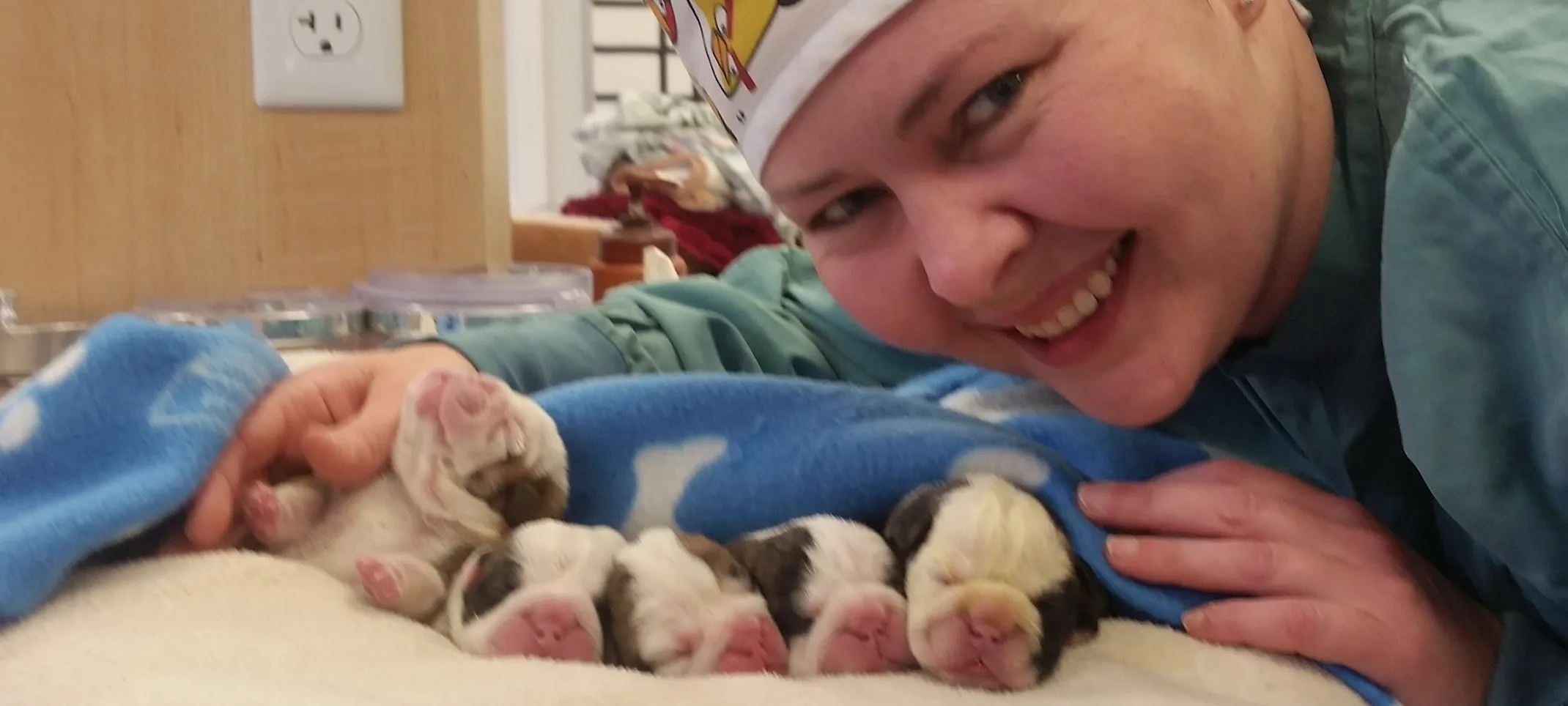 Staff member with puppies Staff member with puppies