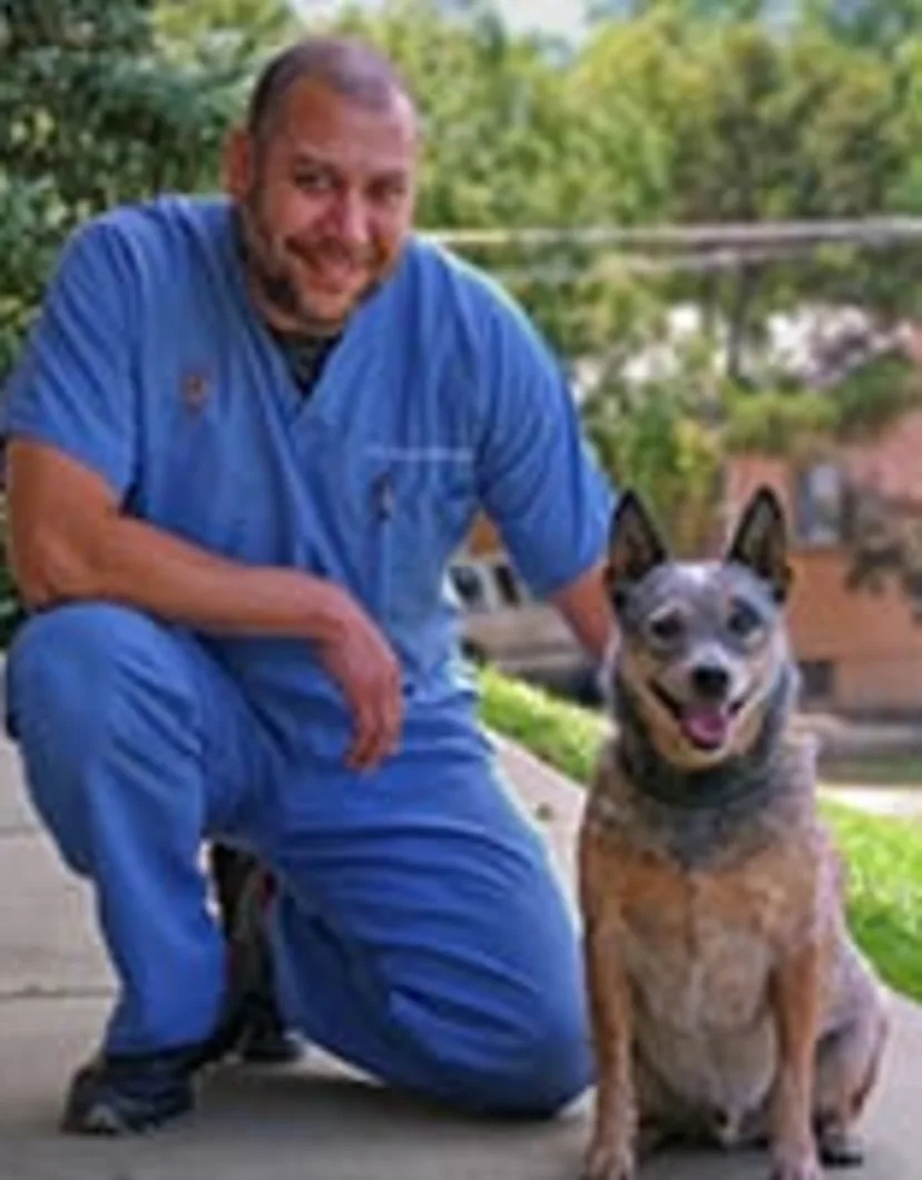 David Glover, DVM at Uintah Pet Emergency, with dog