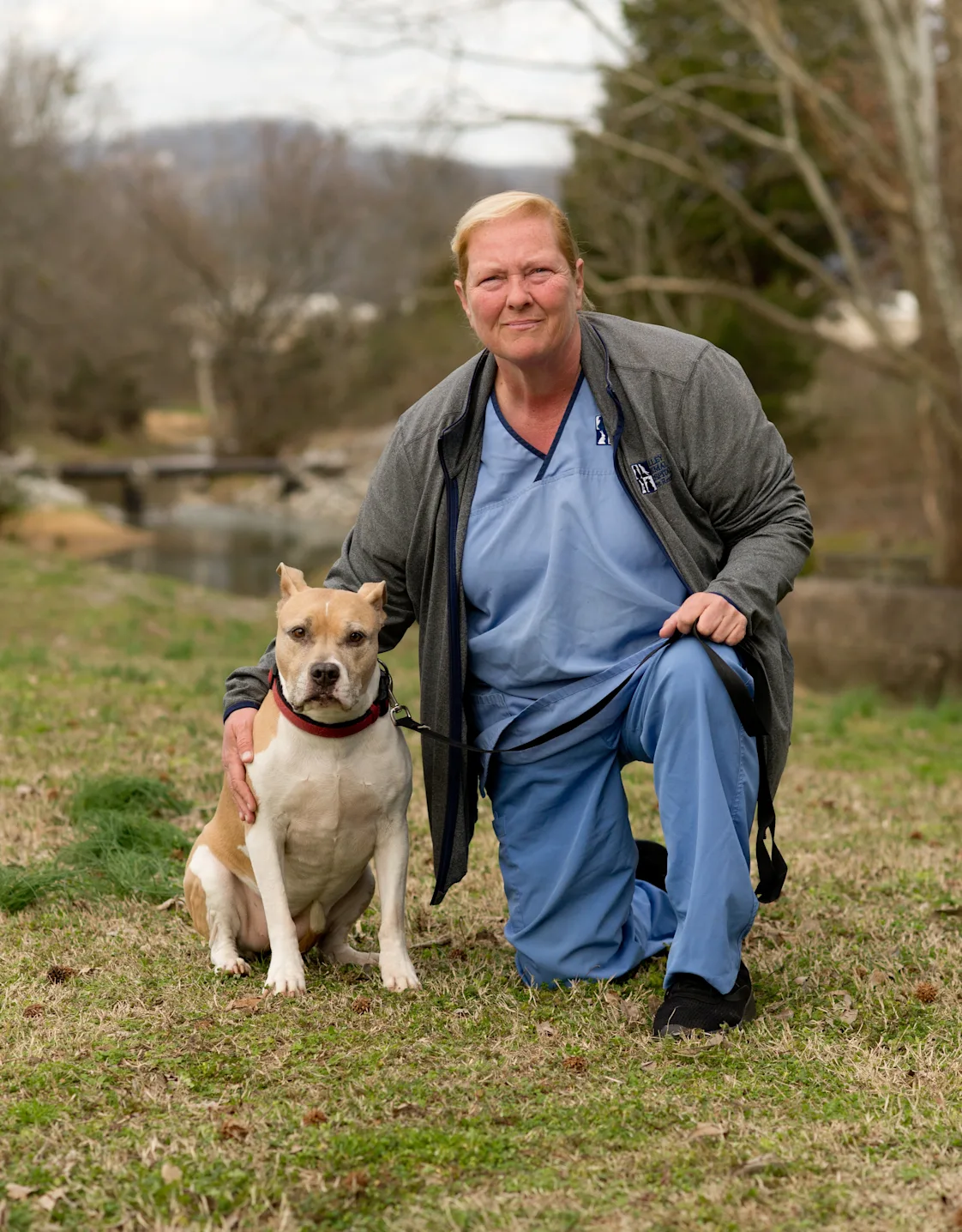 Kim's staff photo from Valley Animal Hospital & Pet Resort where she is outside at a park with her dog Kim's staff photo from Valley Animal Hospital & Pet Resort where she is outside at a park with her dog