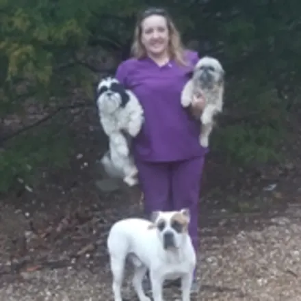 Nichole Gomez with three dogs