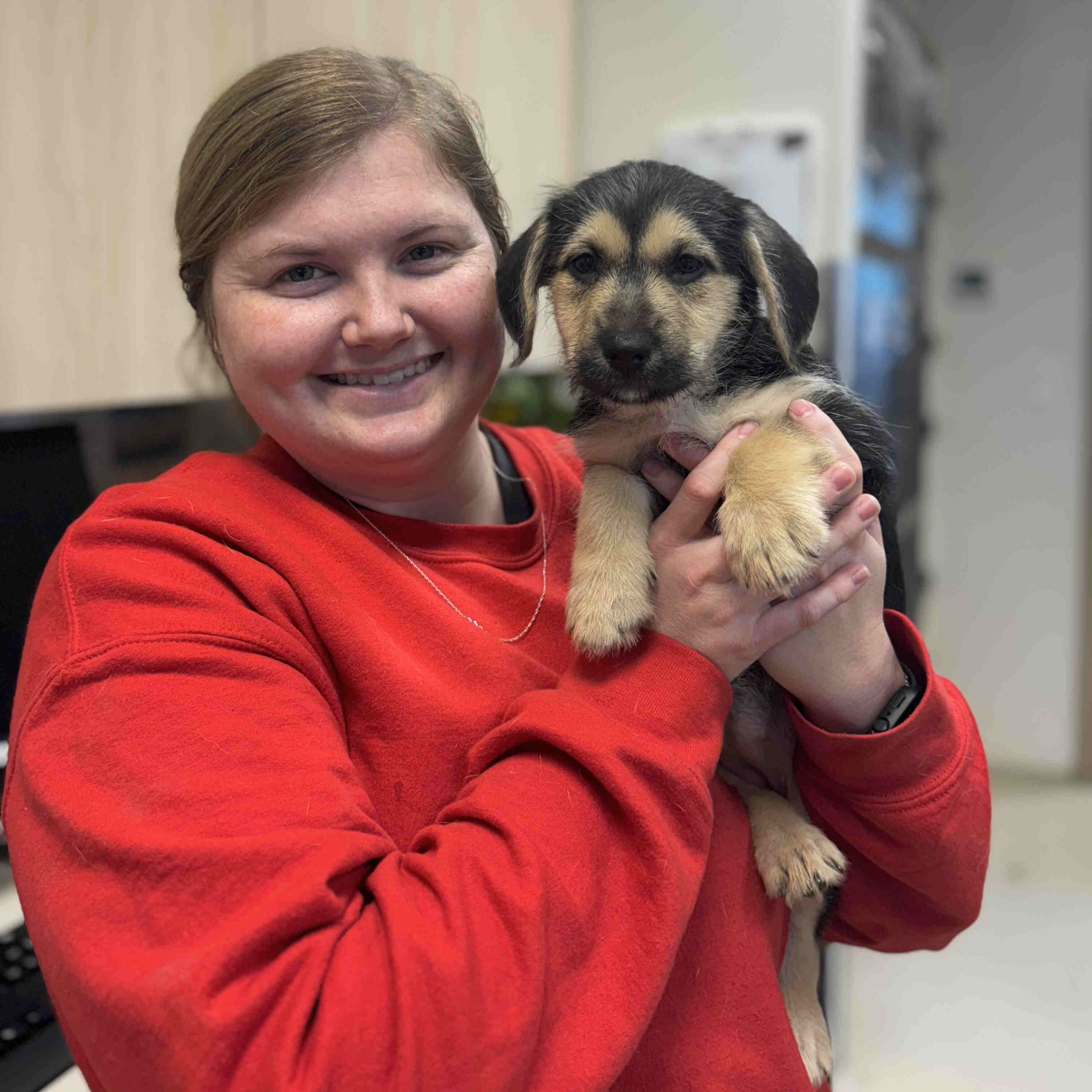 Our Staff with a Happy Puppy