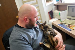 Animal Care Center of Polaris staff holding cat