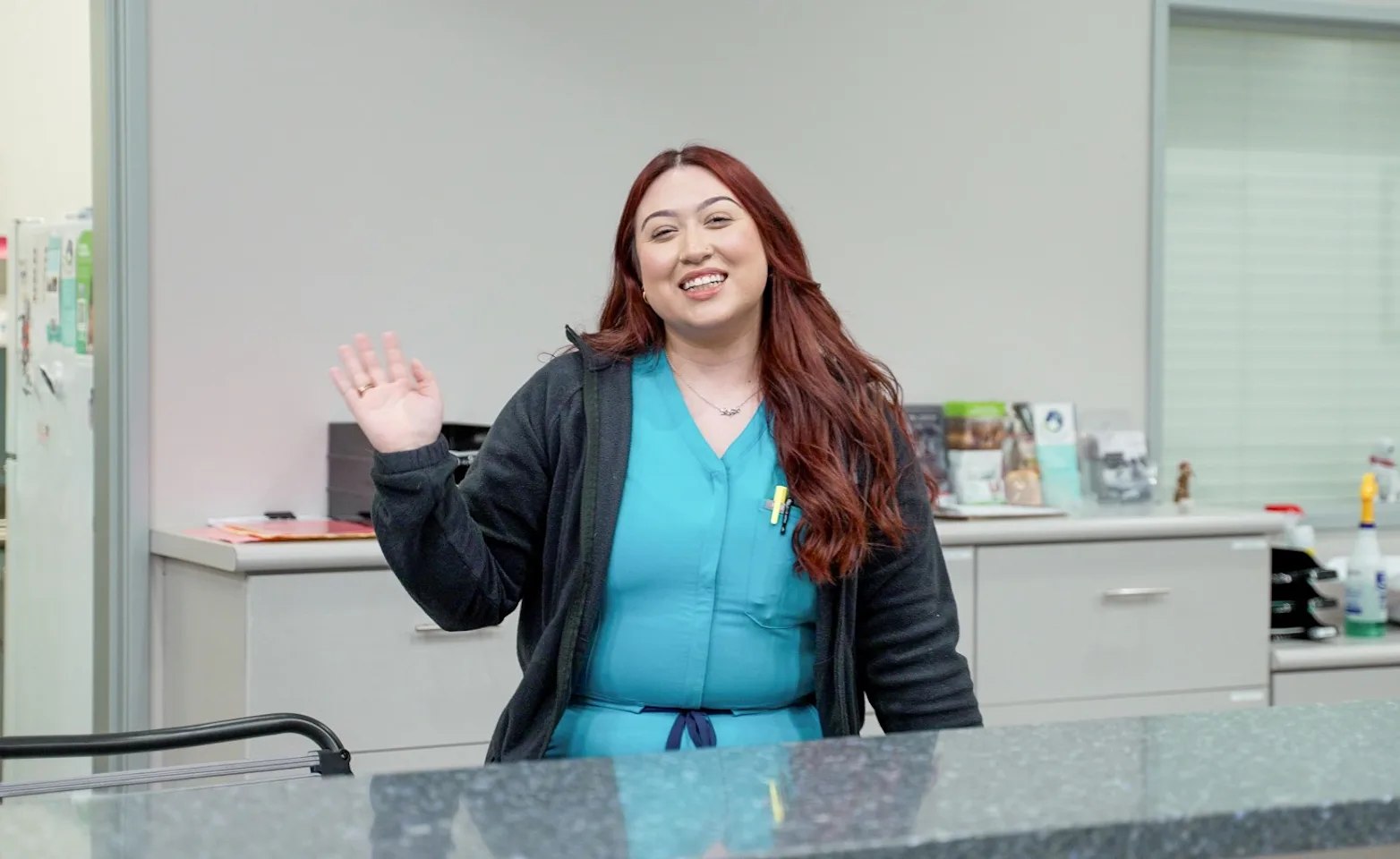 Staff Member waving Staff Member waving