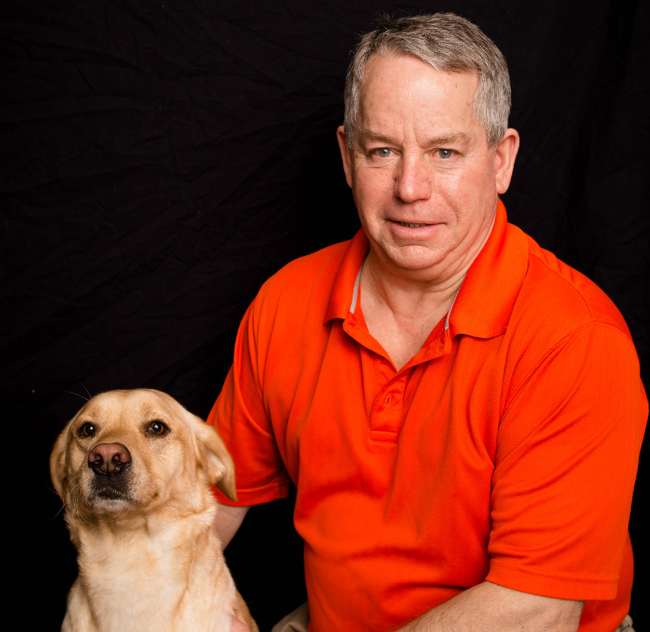 A Kindness Animal Hospital staff member with a dog