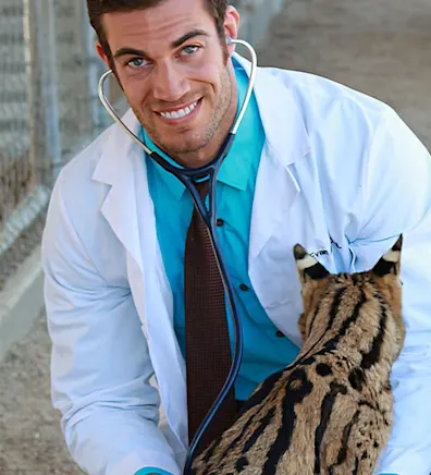 Dr. Evan Antin with a large cat Dr. Evan Antin with a large cat