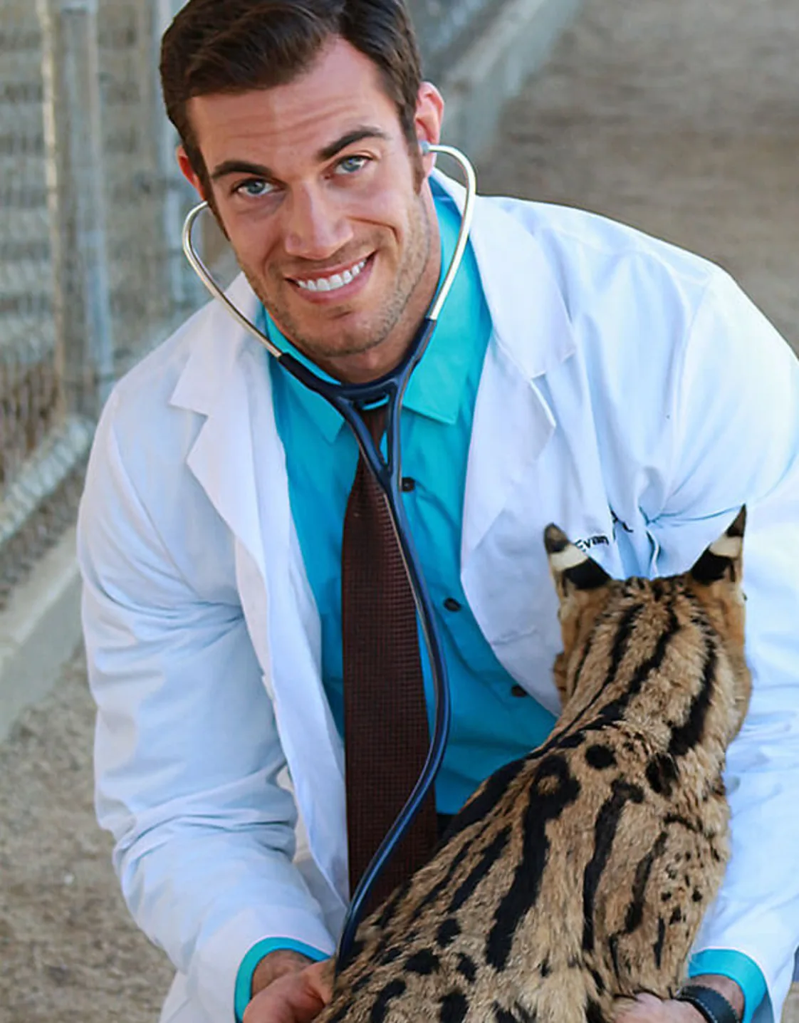 Dr. Evan Antin with a large cat Dr. Evan Antin with a large cat