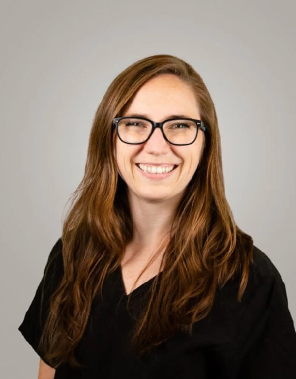 A photo of Dr. Sheehan smiling. A photo of Dr. Sheehan smiling.