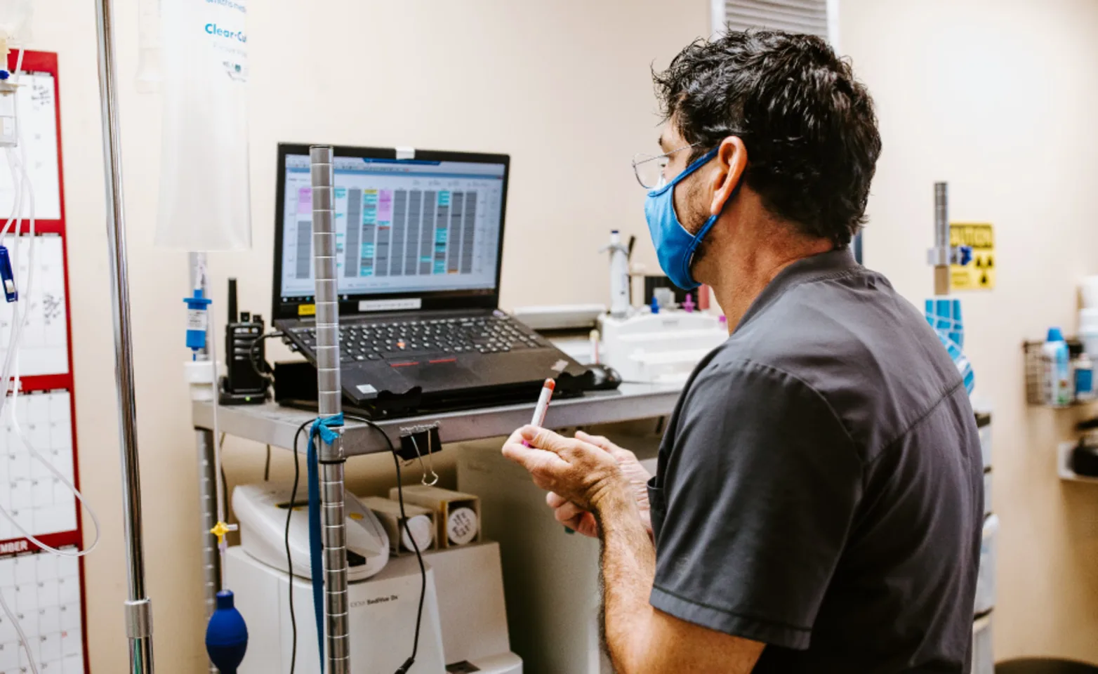 Staff Mike reading test results at Overland Veterinary Clinic Staff Mike reading test results at Overland Veterinary Clinic