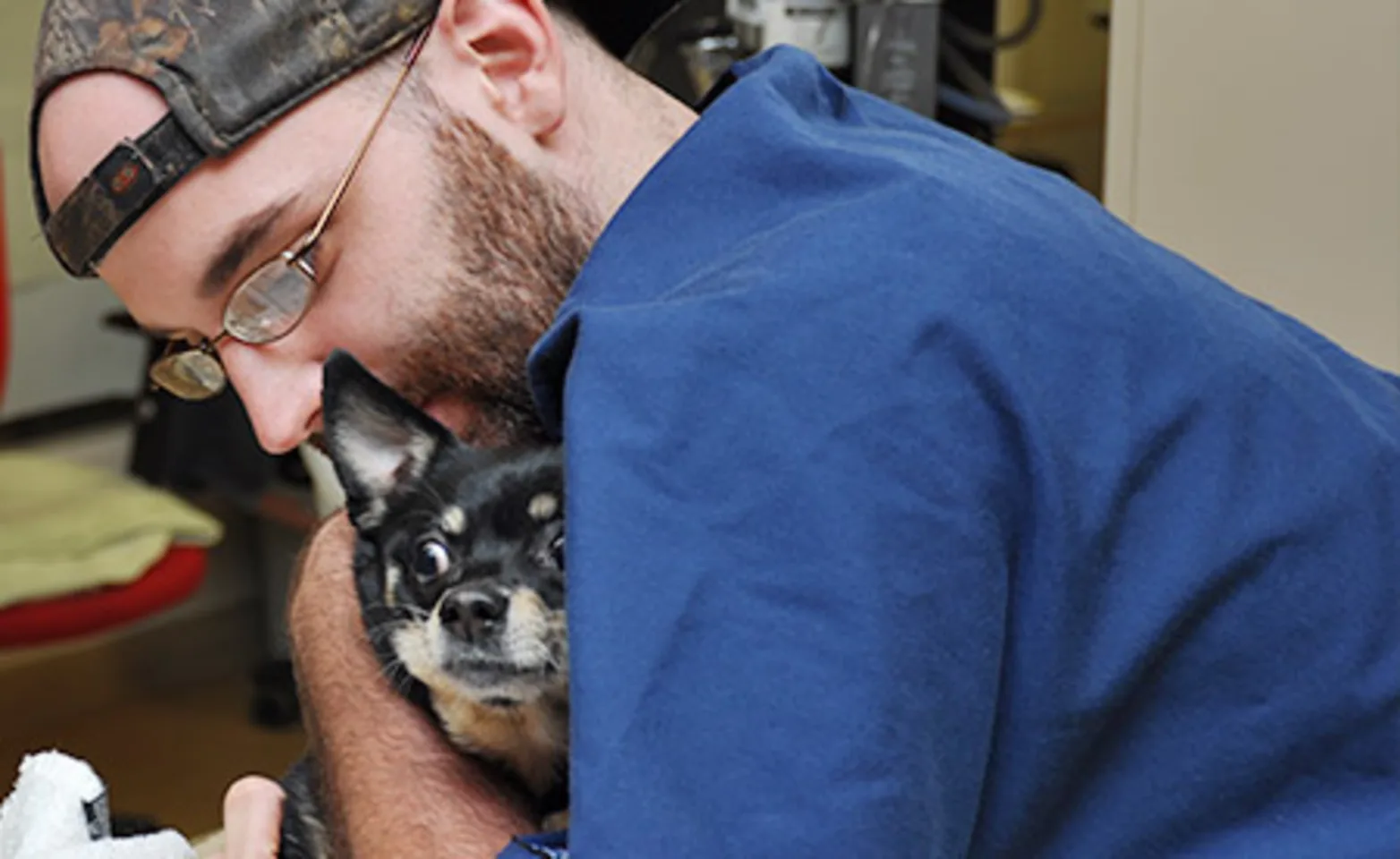 AECC staff holding dog AECC staff holding dog