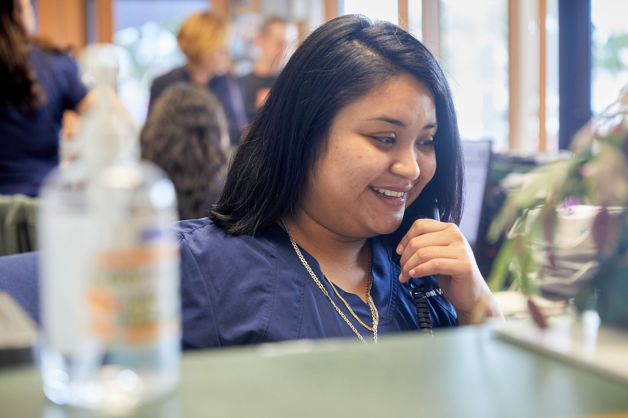 Karen is smiling while working