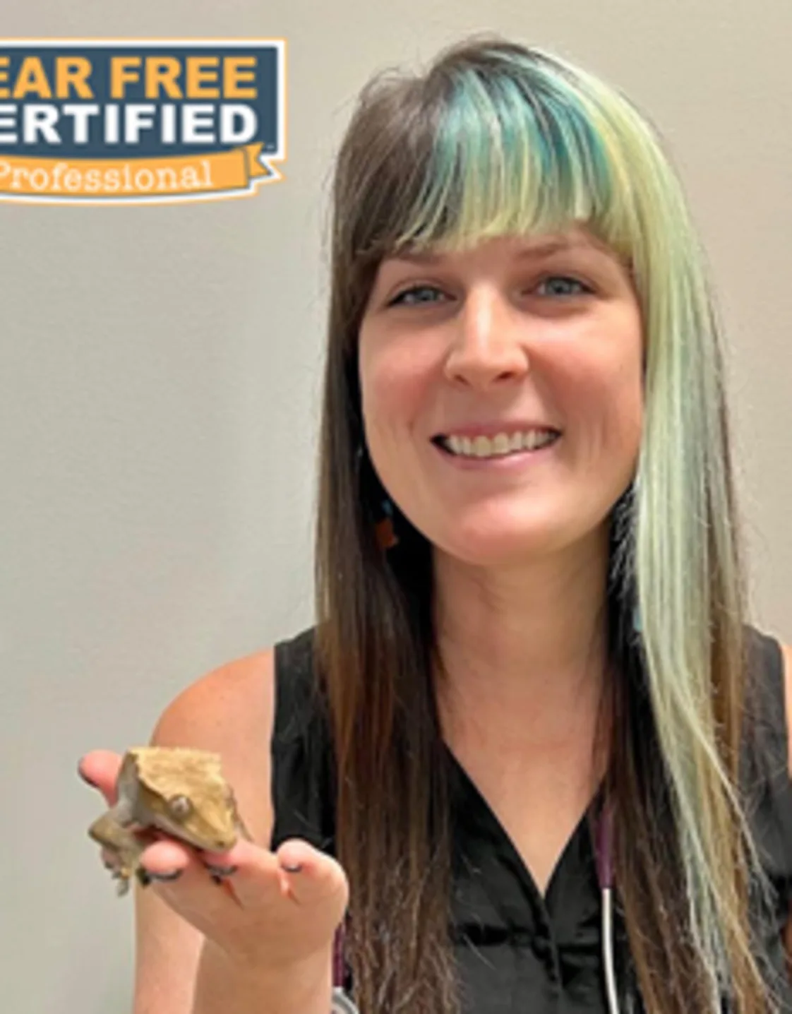Dr. Aubrey Traina holding a lizard Dr. Aubrey Traina holding a lizard