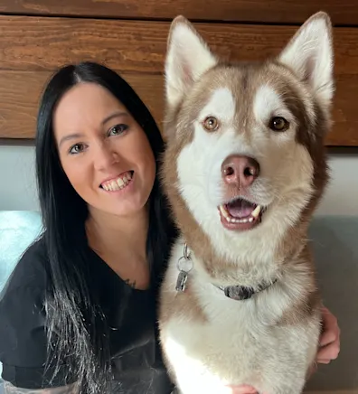 Cassie, staff at Rose Valley Veterinary Hospital, with husky