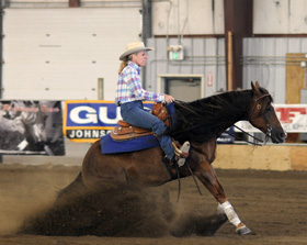 person riding horse in dirt