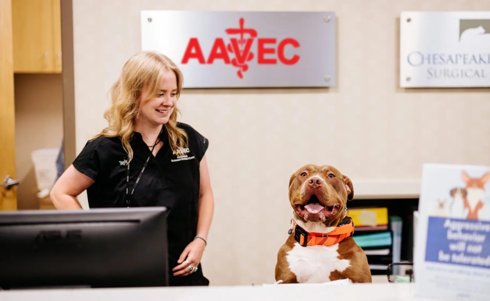 woman and dog in front of AAVEC reception woman and dog in front of AAVEC reception