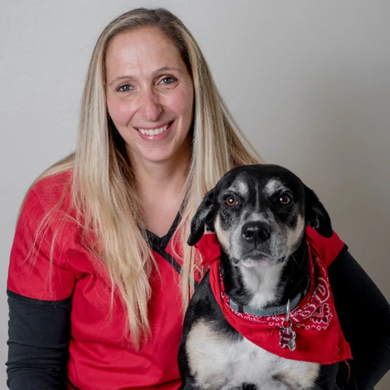 Dr. Kiara Falco with a dog Dr. Kiara Falco with a dog