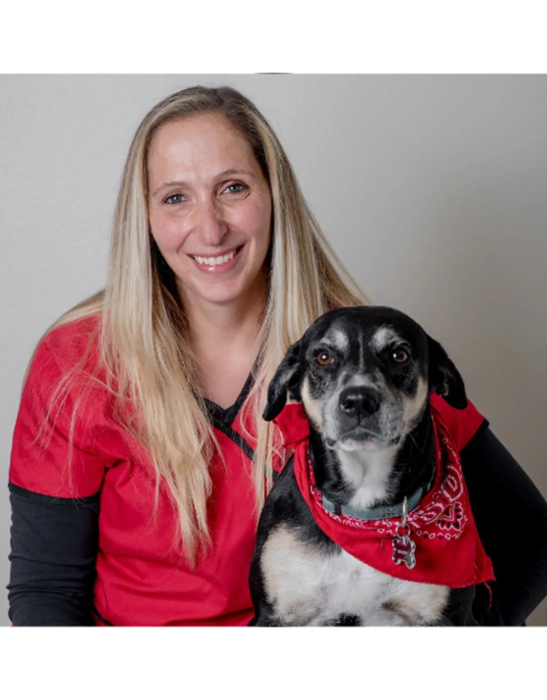 Dr. Kiara Falco with a dog Dr. Kiara Falco with a dog
