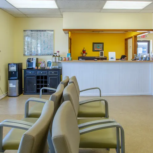 Front Desk, refreshment table, and waiting area in the lobby of Family Pet Clinic of Grapevine.
