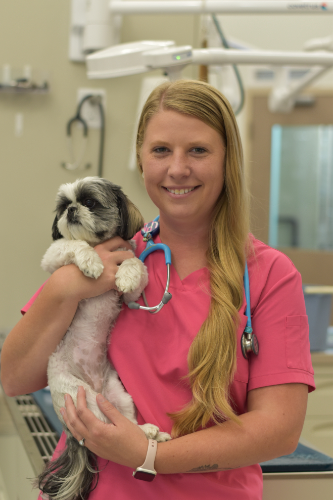 Lisa Holding a Small Puppy