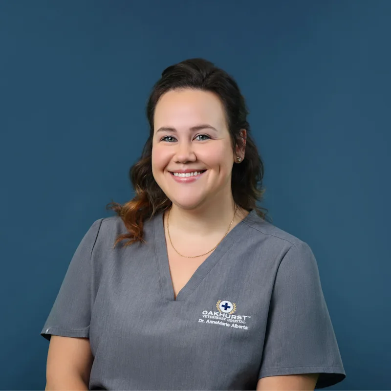 Dr. Annemarie Alberta holding a French Bulldog Dr. Annemarie Alberta holding a French Bulldog