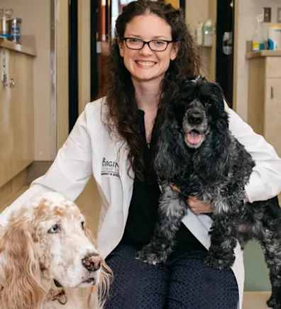 Megen Daugherty with small black dog and big cream dog Megen Daugherty with small black dog and big cream dog