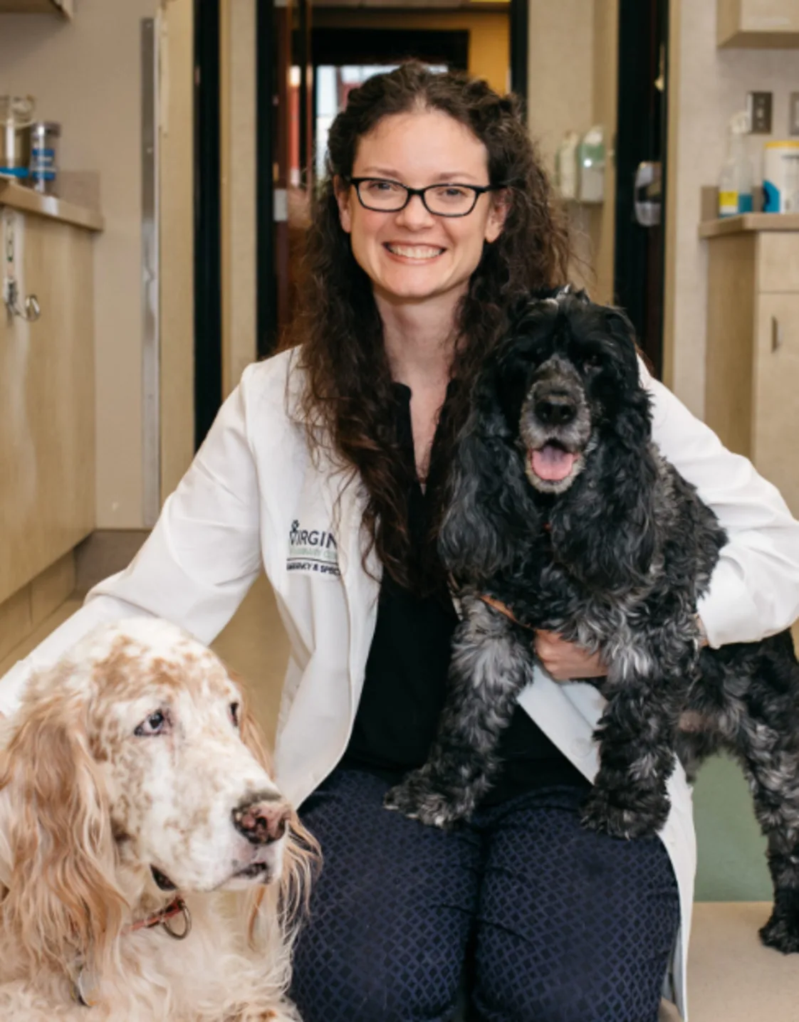 Megen Daugherty with small black dog and big cream dog Megen Daugherty with small black dog and big cream dog