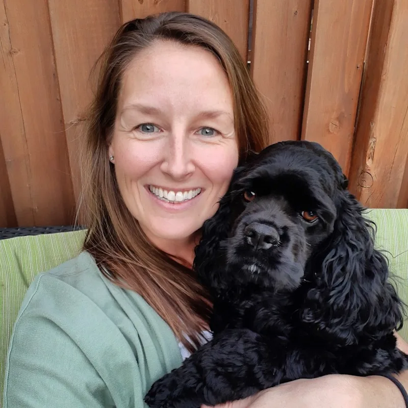 Dr. Kate Kelly, doctor at Three Islands Veterinary Services, holding a black dog Dr. Kate Kelly, doctor at Three Islands Veterinary Services, holding a black dog