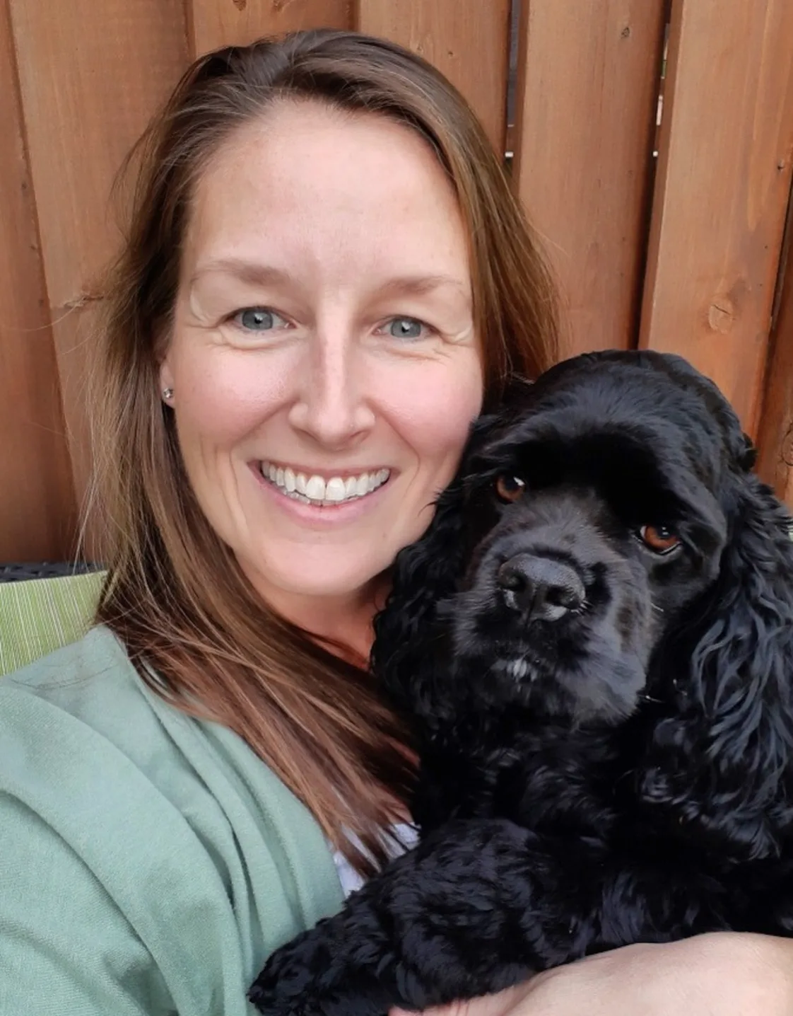 Dr. Kate Kelly, doctor at Three Islands Veterinary Services, holding a black dog Dr. Kate Kelly, doctor at Three Islands Veterinary Services, holding a black dog