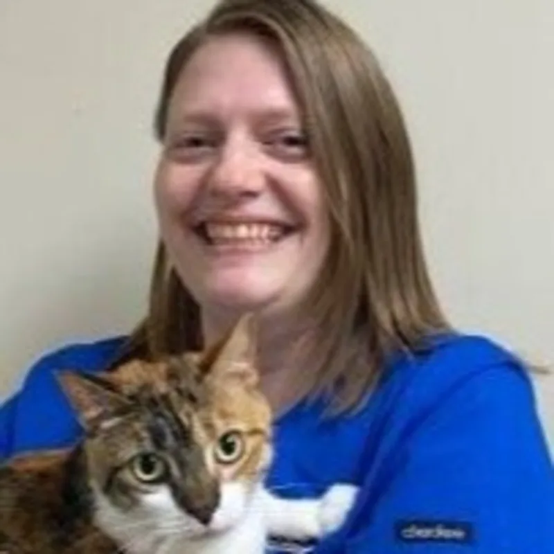 Melissa holding a brown and white cat Melissa holding a brown and white cat