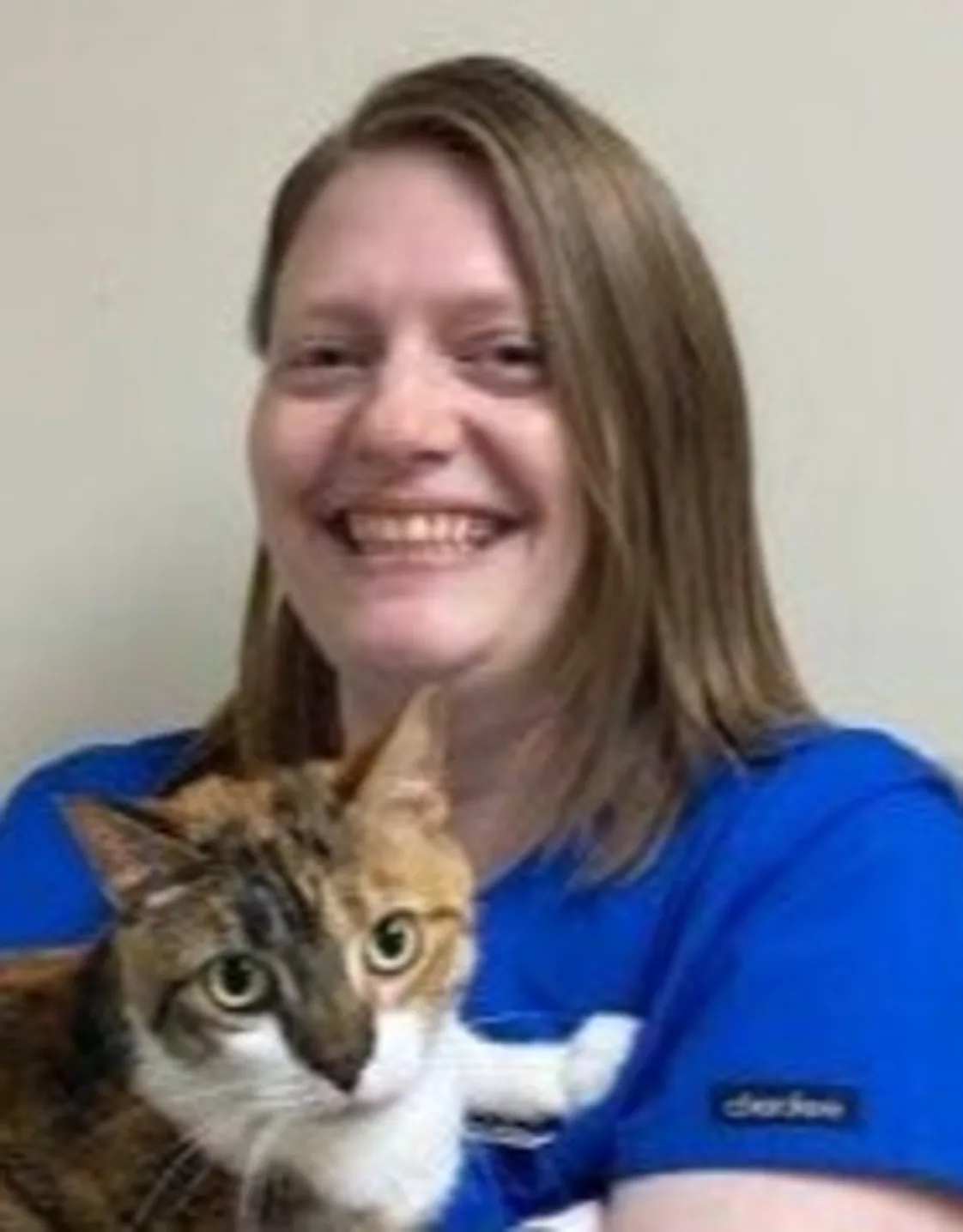 Melissa holding a brown and white cat Melissa holding a brown and white cat