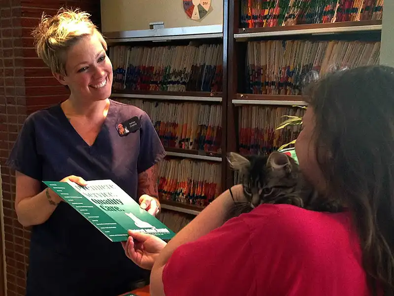 Staff explaining a piece of material to a client