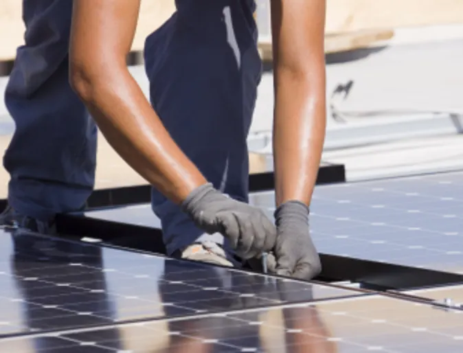 Person working on Solar Panel Person working on Solar Panel