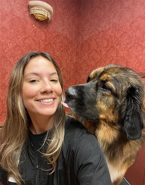 Faith, Groomer at The Barkley with dog