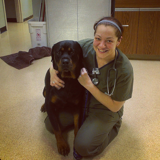 dog and staff member smiling