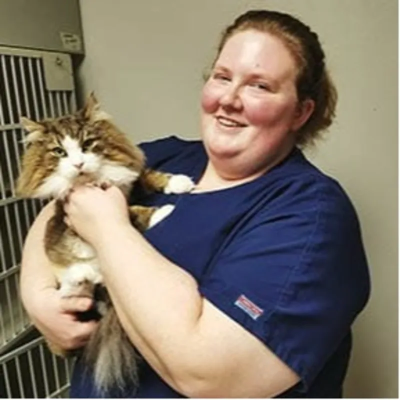 Megan - RVT holding orange and white cat at Animal Care Clinic West & Metro Cat Hospital Megan - RVT holding orange and white cat at Animal Care Clinic West & Metro Cat Hospital